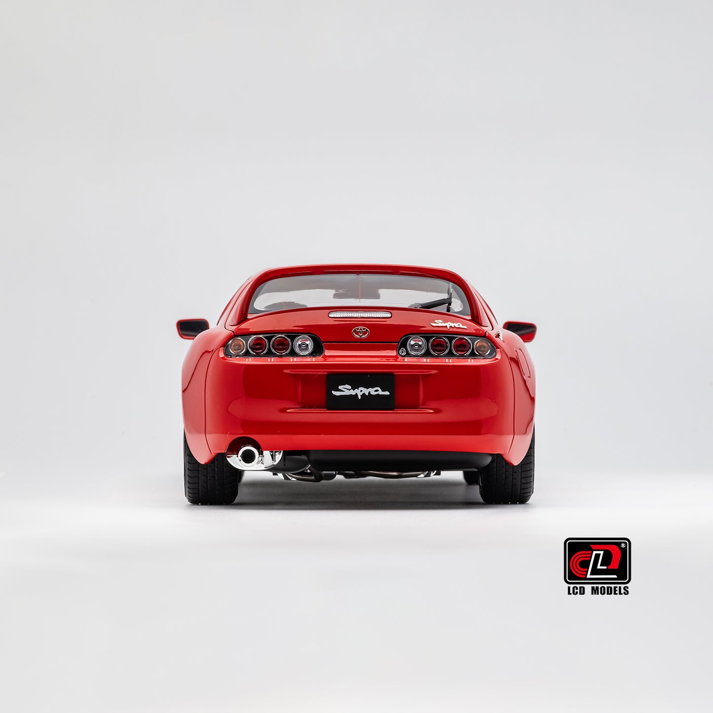 LCD Toyota Supra A80 (Red color) *Comes with a lift!!* 1:18