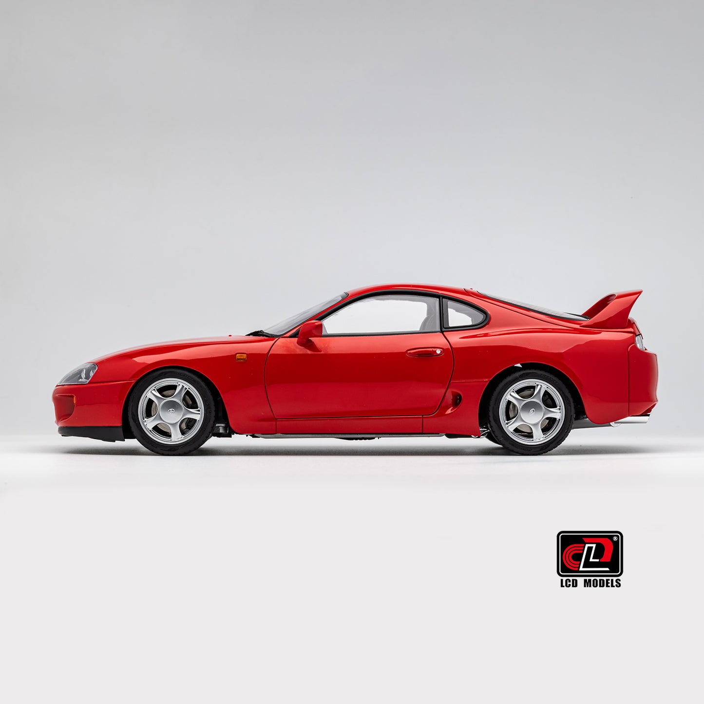 LCD Toyota Supra A80 (Red color) *Comes with a lift!!* 1:18