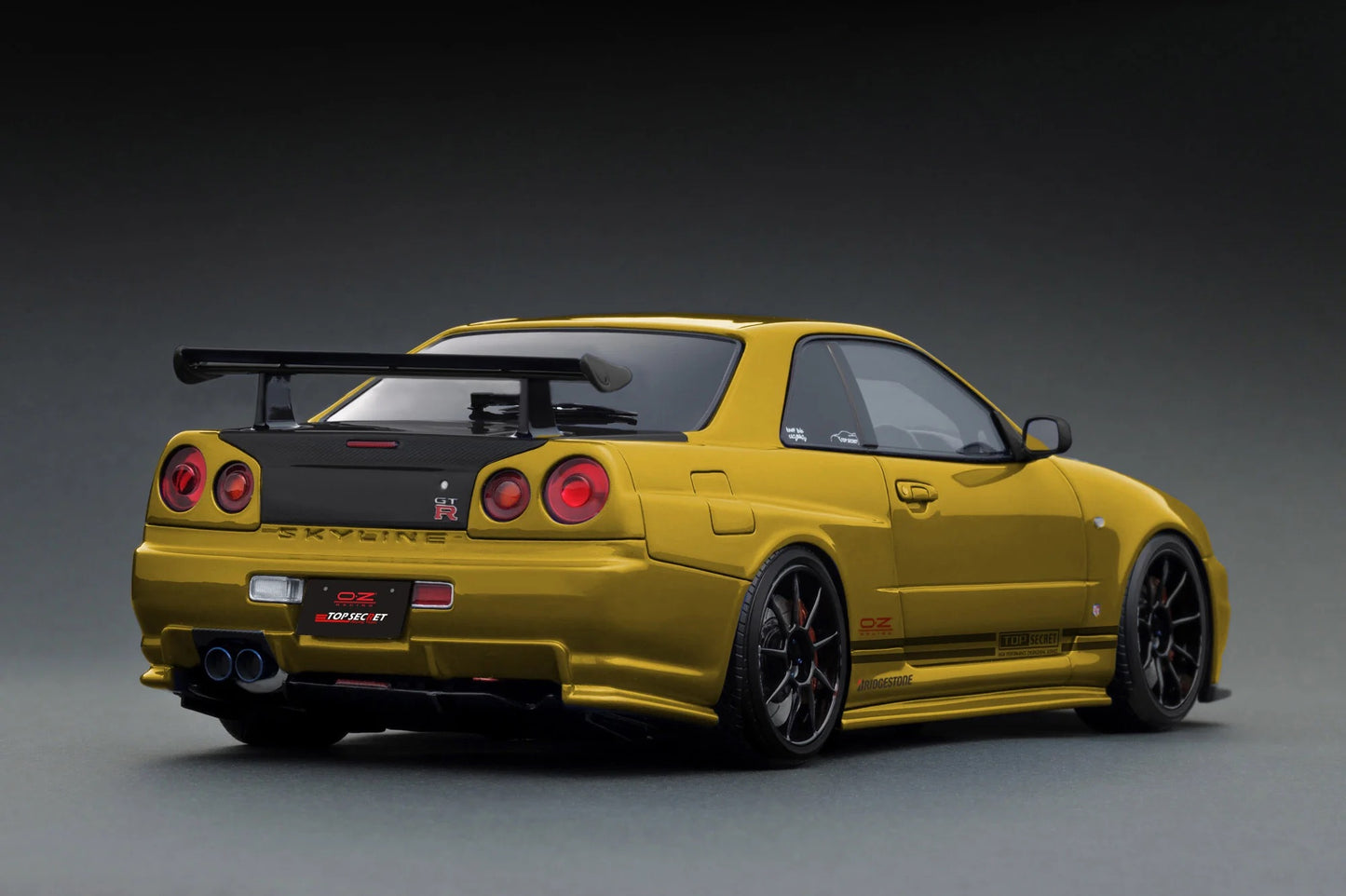 Ignition-Model Nissan Skyline GT-R R34 (BNR34) Top Secret 34GT-R RHD Gold w/ Carbon Fiber Hood 1:18