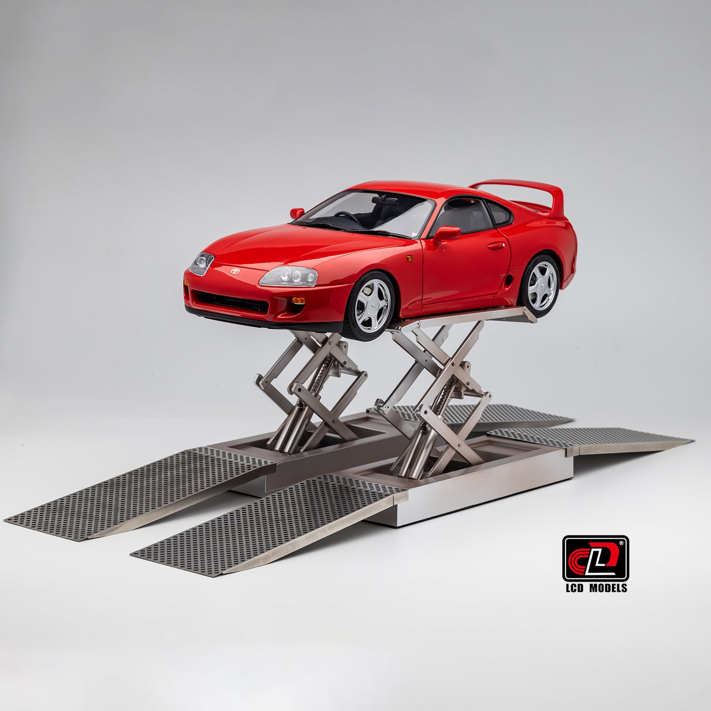 LCD Toyota Supra A80 (Red color) *Comes with a lift!!* 1:18