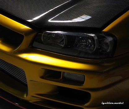 Ignition-Model Nissan Skyline GT-R R34 (BNR34) Top Secret 34GT-R RHD Gold w/ Carbon Fiber Hood 1:18