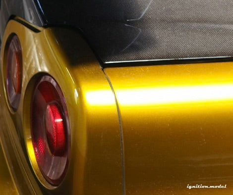 Ignition-Model Nissan Skyline GT-R R34 (BNR34) Top Secret 34GT-R RHD Gold w/ Carbon Fiber Hood 1:18