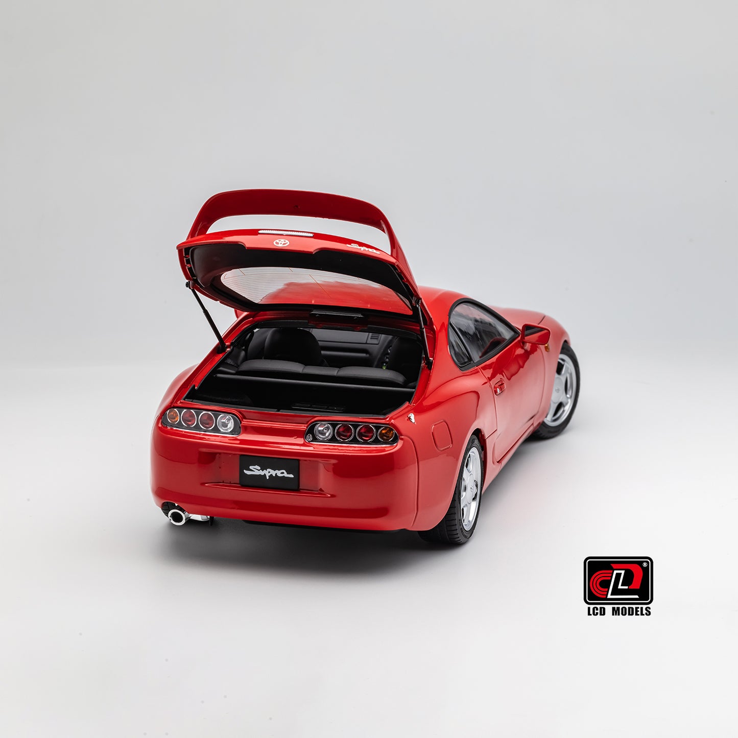 LCD Toyota Supra A80 (Red color) *Comes with a lift!!* 1:18